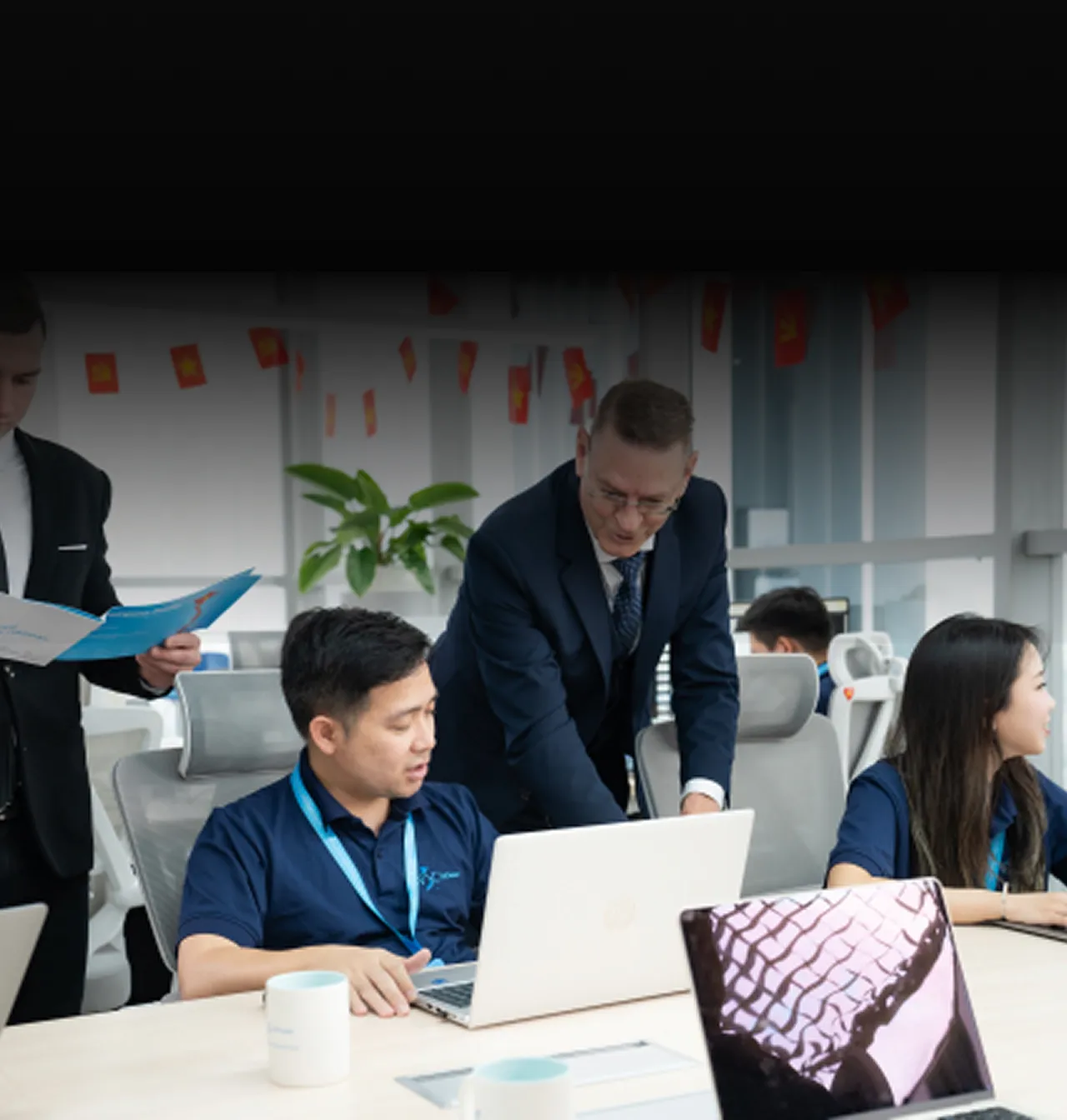 NSC senior engineers collaborating in a modern office