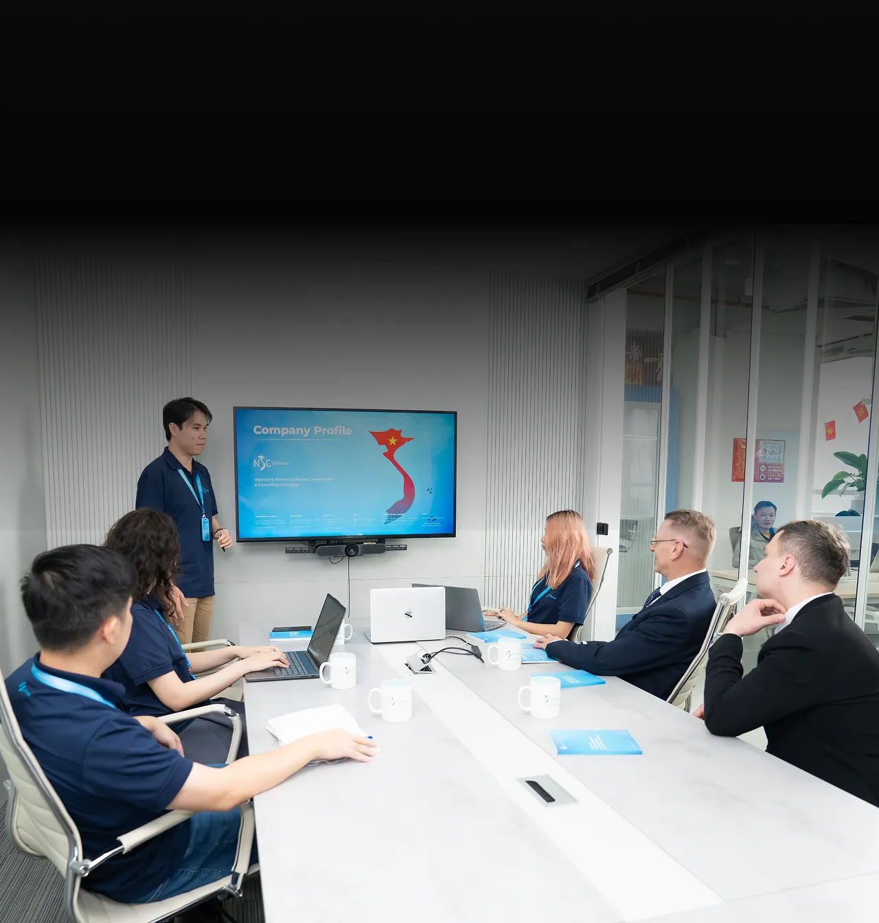 NSC senior engineers collaborating in a modern office